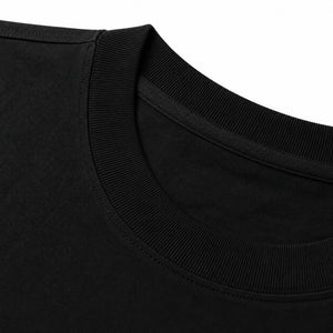 Ribbed collar and shoulder seam of the black t-shirt