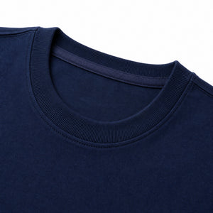 Ribbed collar and shoulder seam of the navy t-shirt
